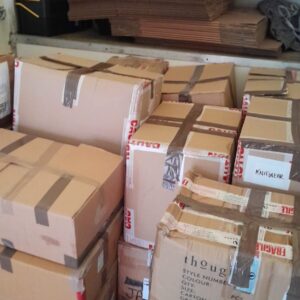 Commercial knitwear stock crates loaded for long-distance delivery from London