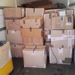Commercial stock boxes loaded in Luton van — long-distance delivery service