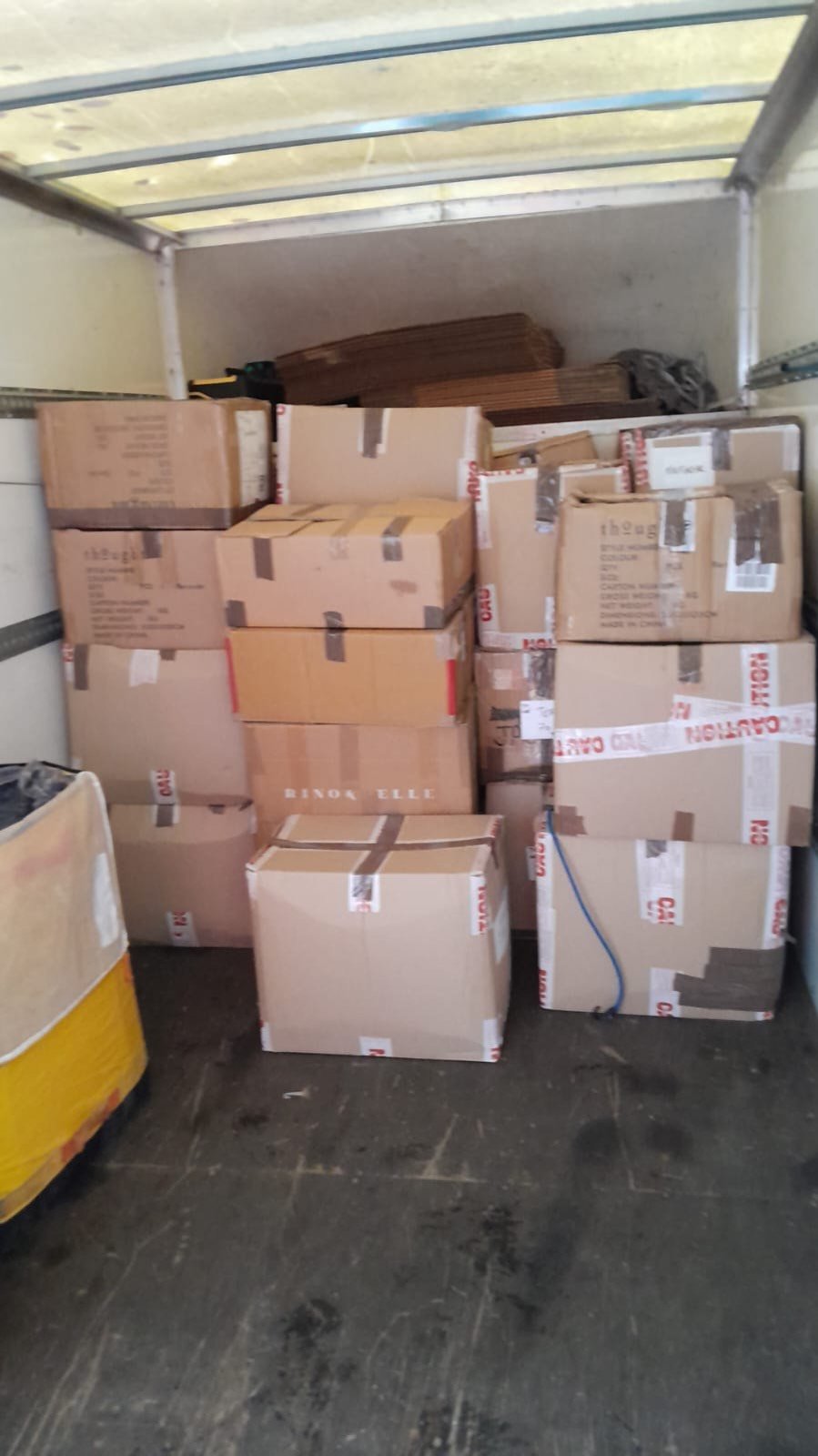 Commercial stock boxes loaded in Luton van — long-distance delivery service
