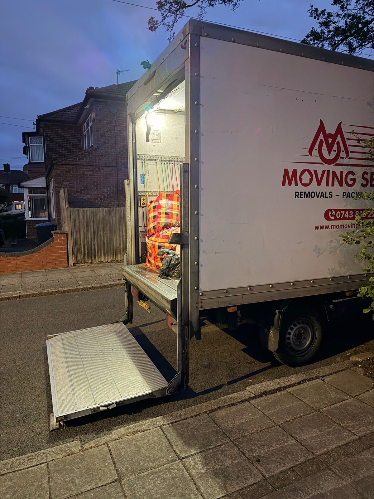 Evening removal in London — branded Man and Van loading at dusk