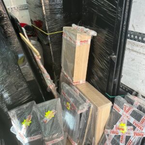 Fragile items wrapped in protective film with FRAGILE tape — Man and Van London