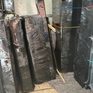 Fragile items wrapped in protective film with FRAGILE tape — Man and Van London