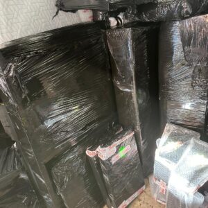 Fragile items wrapped in protective film with FRAGILE tape — Man and Van London