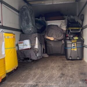 House removals van loaded with blanket-wrapped furniture — London