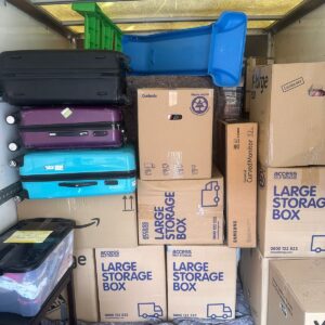 House removals van loaded with blanket-wrapped furniture — London
