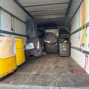 IKEA & eBay delivery service — stacked flat-pack boxes loaded onto a dolly in London