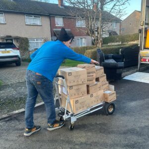 IKEA & eBay delivery service — stacked flat-pack boxes loaded onto a dolly in London