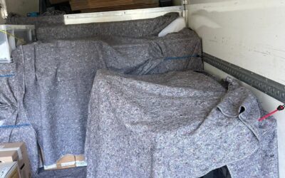 Office chair blanket-wrapped inside van — office removals London