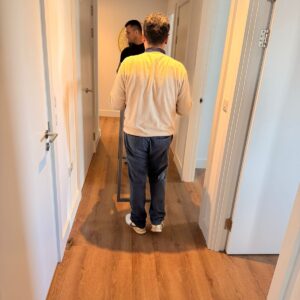Professional packing service — mover wrapping furniture in London
