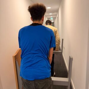 Professional packing service — mover wrapping furniture in London
