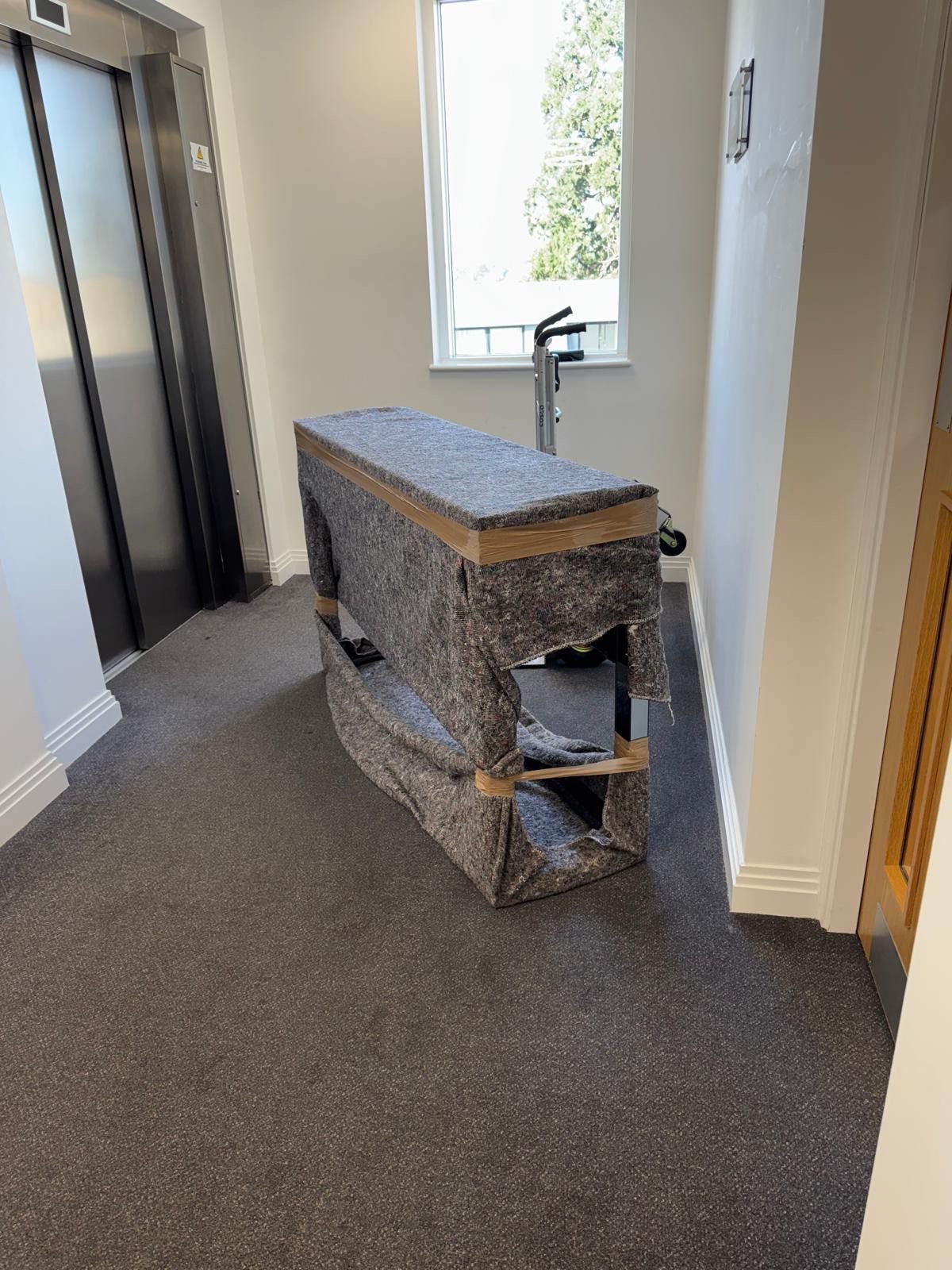 Single-item sofa delivery — sofa professionally blanket-wrapped on site