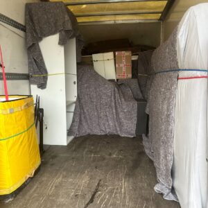 Single-item delivery — washing machine moved into a London kitchen