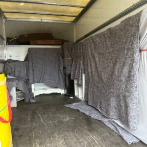Single-item delivery — washing machine moved into a London kitchen