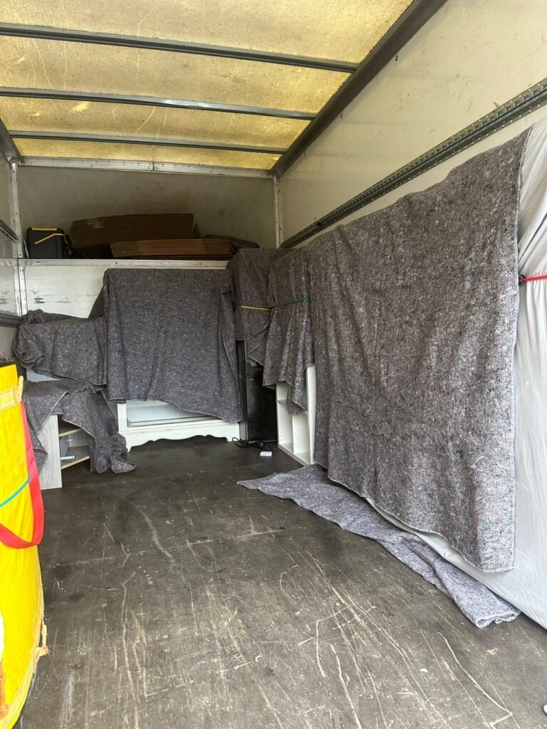 Single-item delivery — washing machine moved into a London kitchen