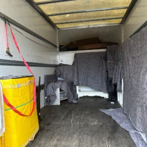 Single-item delivery — washing machine moved into a London kitchen