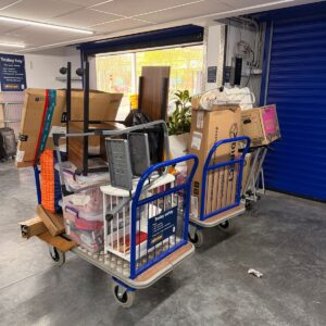 Self-storage solution London — boxes on trolleys at a secure storage facility