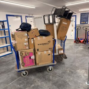 Self-storage solution London — boxes on trolleys at a secure storage facility
