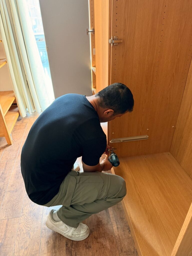 Furniture assembly service in London — wardrobe being assembled with power drill