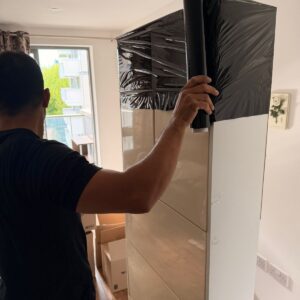 Furniture assembly service in London — wardrobe being assembled with power drill