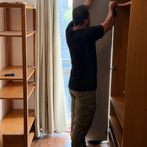 Furniture assembly service in London — wardrobe being assembled with power drill