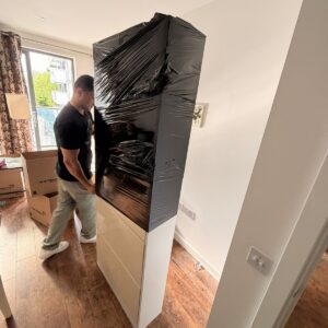 Furniture assembly service in London — wardrobe being assembled with power drill