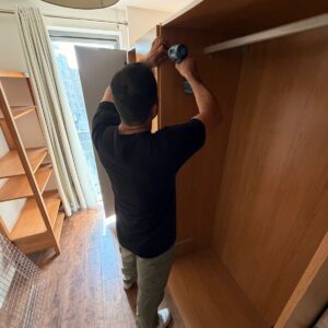 Furniture assembly service in London — wardrobe being assembled with power drill